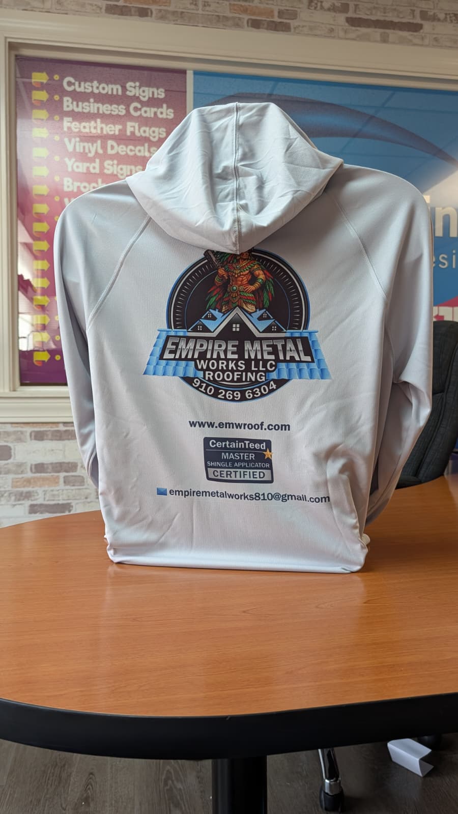 White hoodie branded for Empire Metal Works LLC Roofing