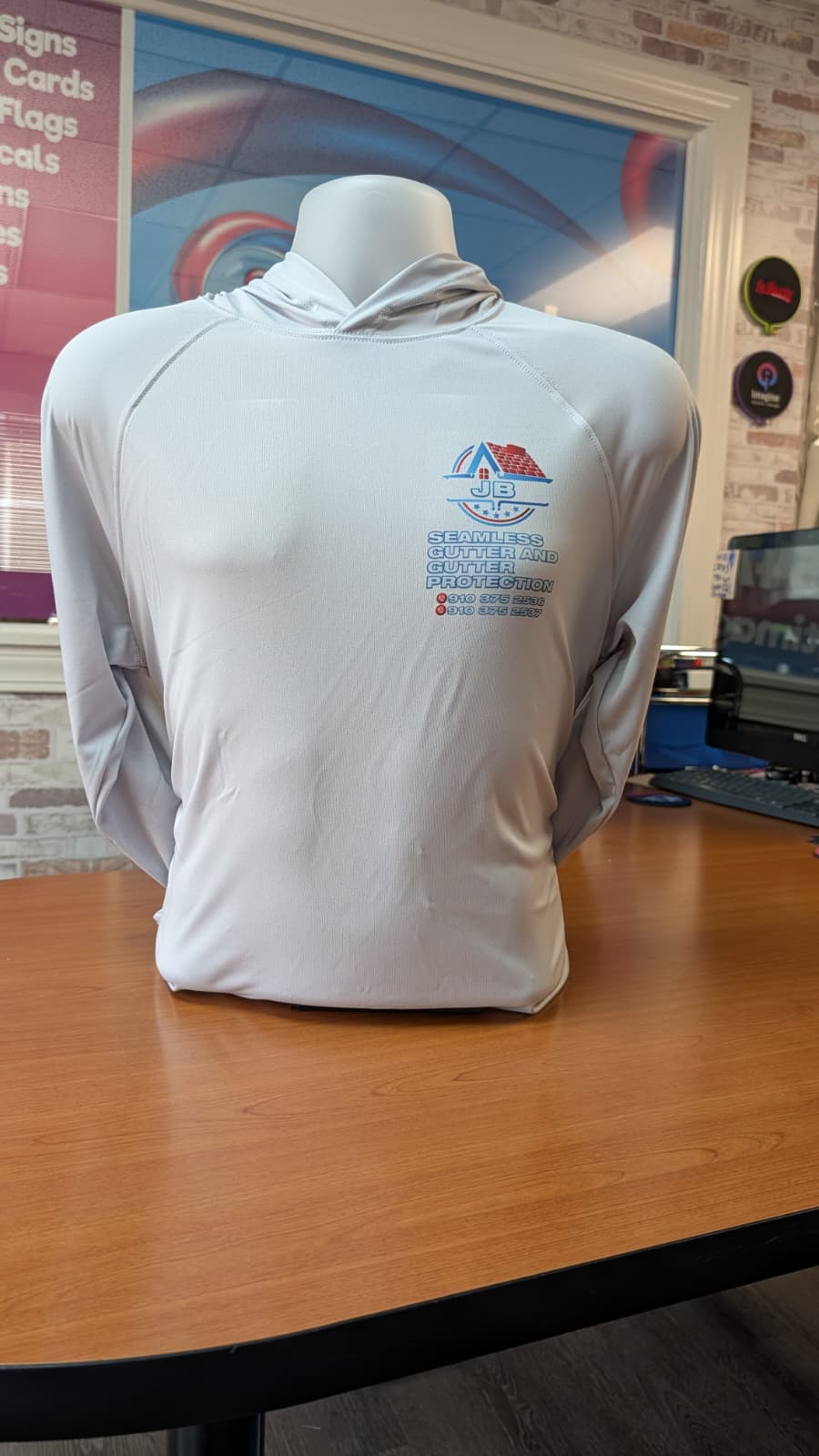 Gray hoodie branded for JB Seamless Gutter and Gutter Protection