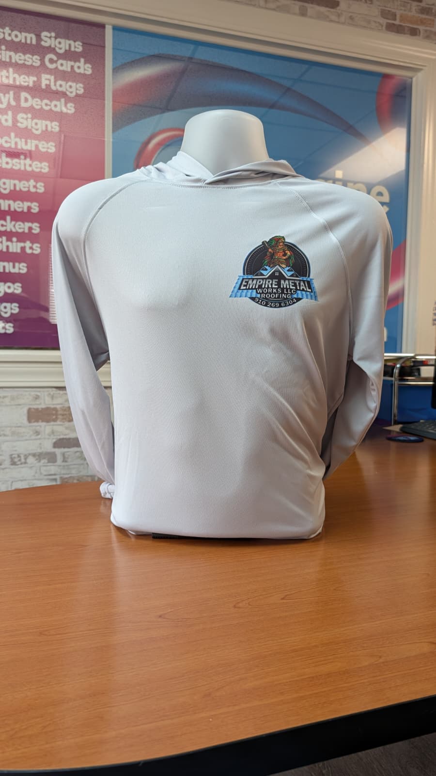 Empire Metal Works LLC Roofing branded hoodie on mannequin