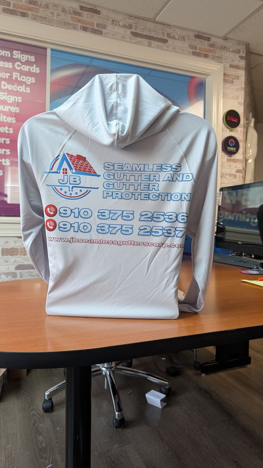 White hoodie branded for JB Seamless Gutter Protection