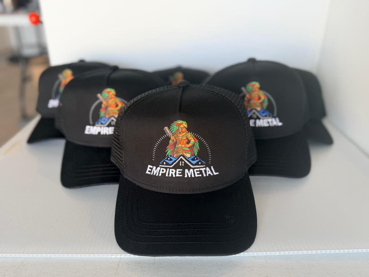 Black trucker hats with Empire Metal warrior logo